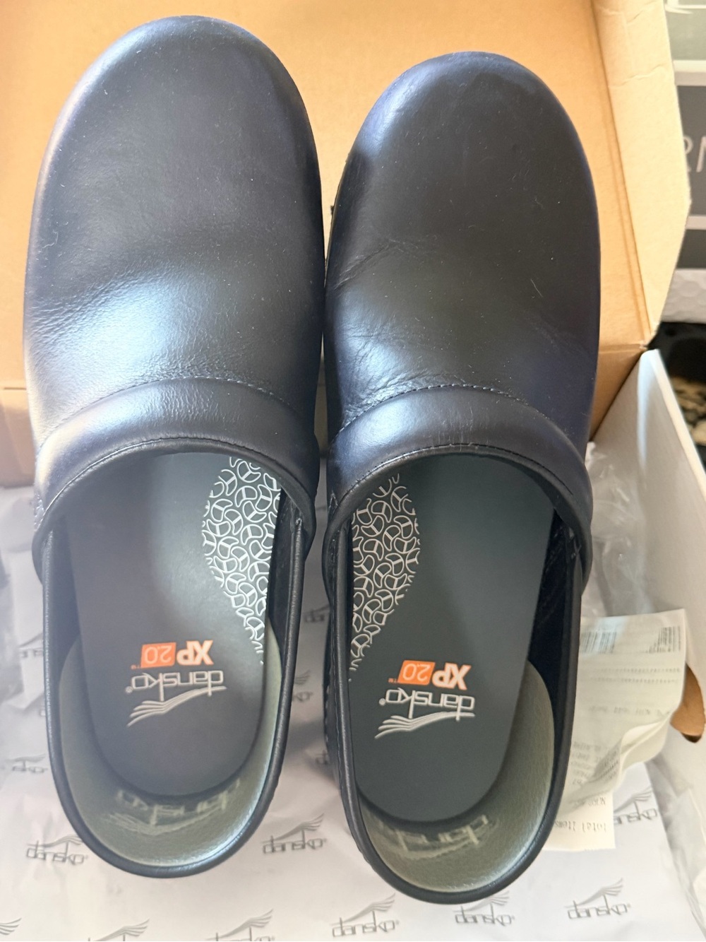Dansko Black Leather Slip-On Women's Clogs